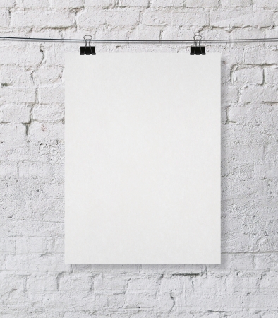brick wall with blank posterの写真素材
