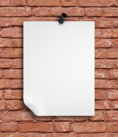 note paper pinned on red brick wallの写真素材
