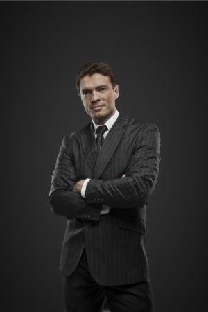 businessman standing on a black backgroundの写真素材