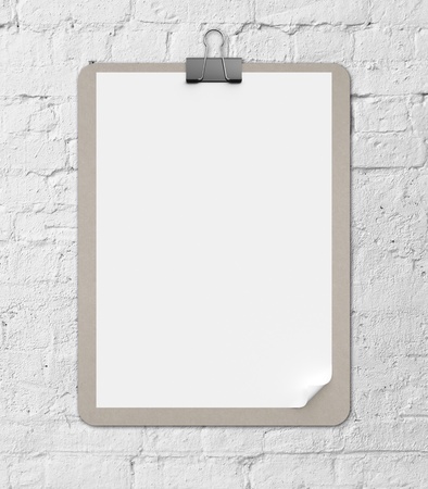 clipboard on a brick wall backgroundの写真素材