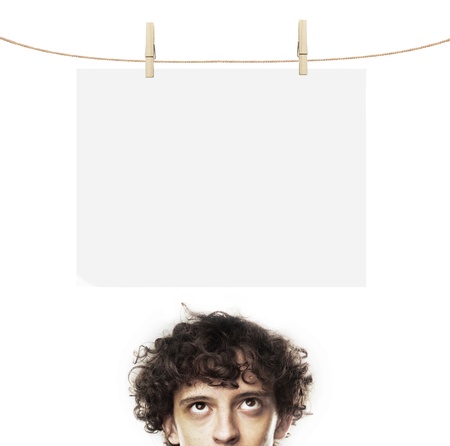 young man thinking and blank paperの写真素材