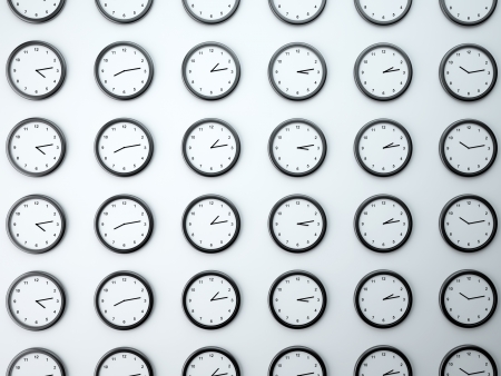 many clock on white wallの写真素材