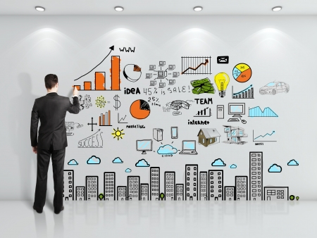 businessman drawing strategy on wallの写真素材