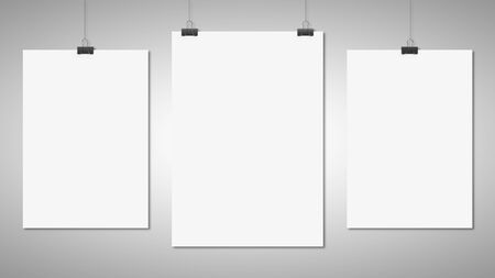 three blank poster clips on white backgroundの写真素材