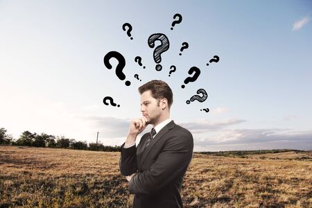 businessman thinking on nature backgroundの写真素材