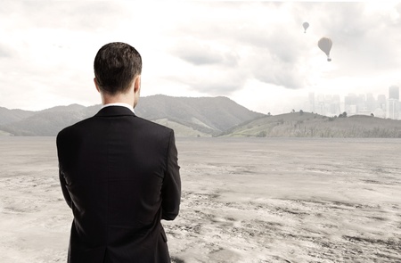 man standing and looking at natureの写真素材