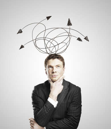 Businessman thinking on a white backgroundの写真素材