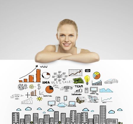 beautiful woman holding white poster with business conceptの写真素材