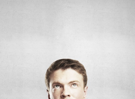 man thinking on gray background