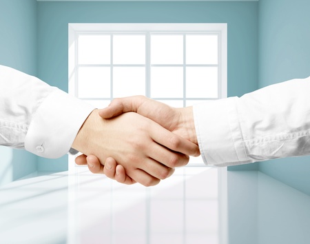 handshake and window on backgroundの写真素材