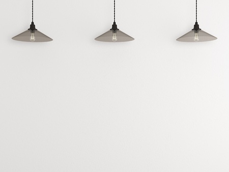 three glass lamp behind the wallの写真素材