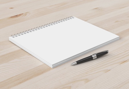 pen and notebook on a wooden background