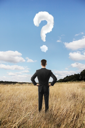 man looking in landscape and question markの写真素材