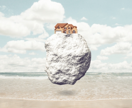 house on rock with sea on backgoundの写真素材