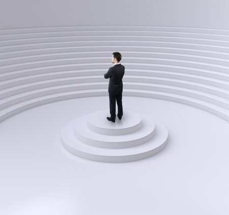 businessman standing on a podium in circle auditoriumの写真素材