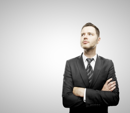 businessman standing and folded his handsの写真素材