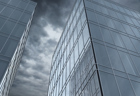 two buildings with glass windowsの写真素材