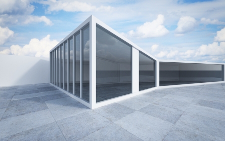 white building exterior with reflection in windowsの写真素材