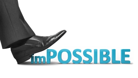 businessman foot crushes impossible text on a white background