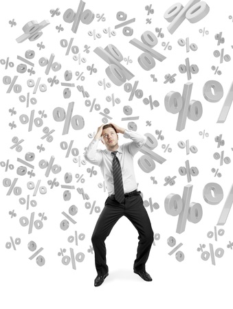 businessman concealed his hands from falling percentage signsの写真素材