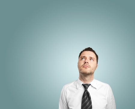 businessman thiking on blue backgroundの写真素材