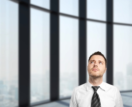 businessman standing in office buildingの写真素材