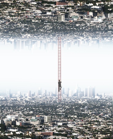young businessman climbing from city to another