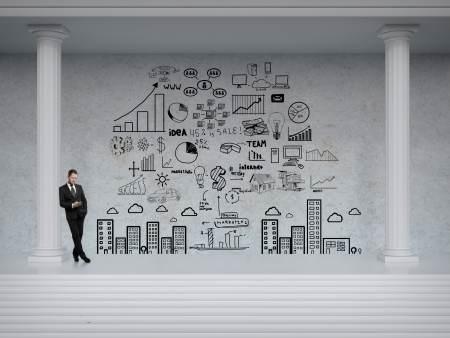 businessman looking at business concept on wallの写真素材
