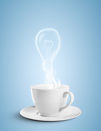 cup of coffee and lamp fume on blue backgroundの写真素材