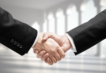 business handshake on a column backgroundの写真素材