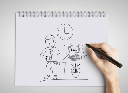 hand drawing businessman on notepadの写真素材