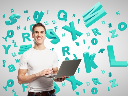 man holding laptop with many lettersの写真素材
