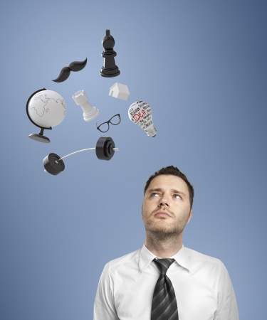 man with mix of items above his headの写真素材