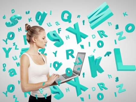 girl holding laptop with many lettersの写真素材