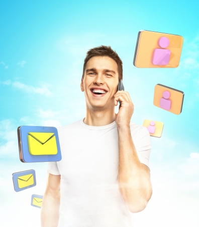 men standing with phone and mail iconsの写真素材