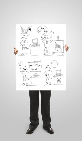 businessman holding a poster with business conceptの写真素材