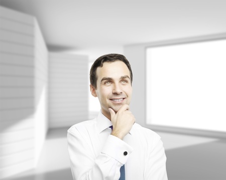 businessman thinking in white roomの写真素材