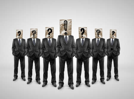 group business people with package on head with drawing question markの写真素材