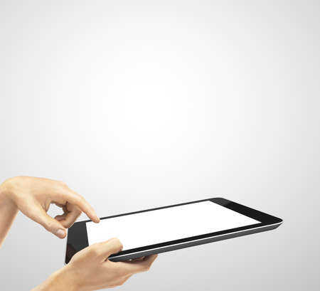hands holding a tablet touch computerの写真素材