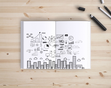 opened book with strategy on wood tableの写真素材