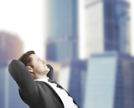businessman sitting in office and dreamingの写真素材