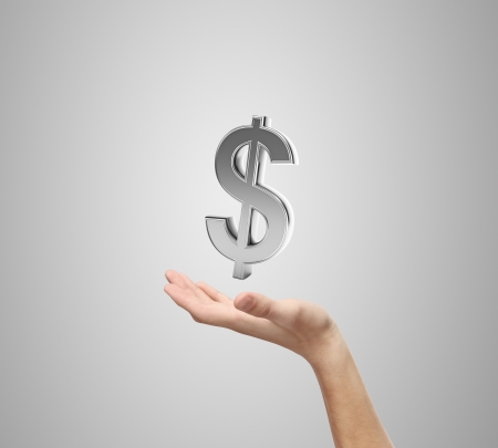 hand and dollar sign on a blue backgroundの写真素材