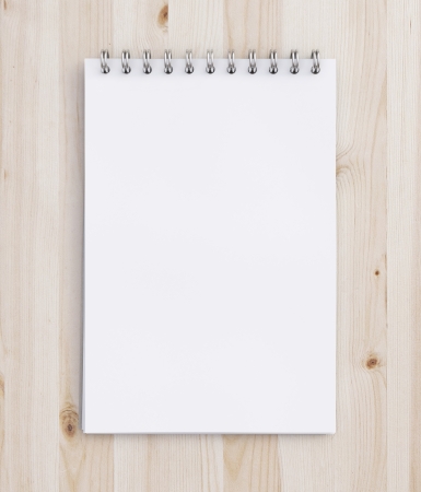 notebook on a wooden tableの写真素材