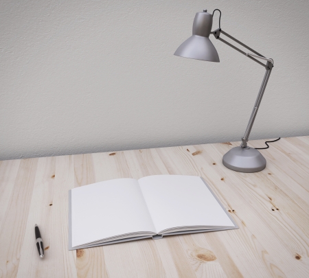 opened book and pen on the table with lampの写真素材
