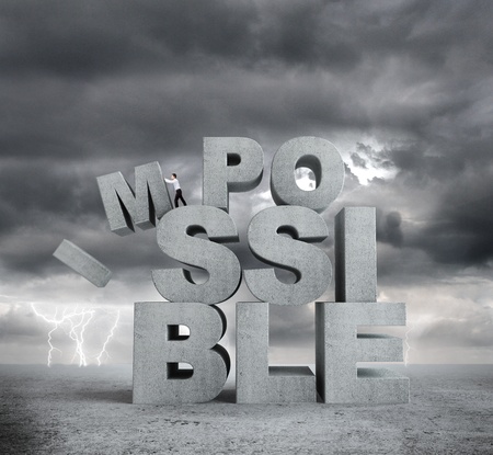 businessman pulling letters impossible concept on bad weather backgroundの写真素材