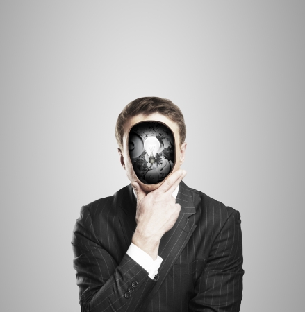 businessman with bubl and gears in headの写真素材