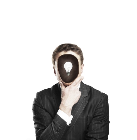 businessman with lamp in headの写真素材