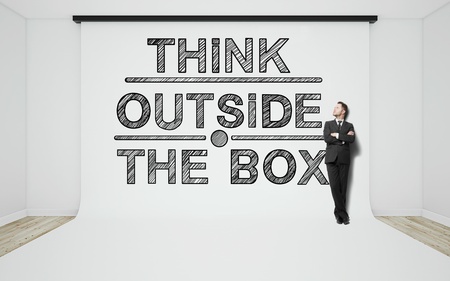 businessman in suit standing in studio with drawing tagsの写真素材