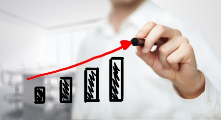 businessman drawing graph in officeの写真素材