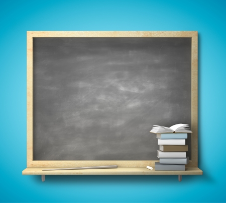 blank blackboard and book on a blue wallの写真素材